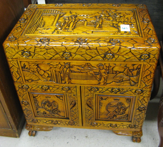 Appraisal: PETITE CARVED WOOD SILVER CHEST Chinese th century the front