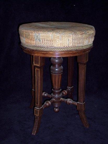 Appraisal: An Edwardian mahogany framed adjustable piano stool the revolving circular