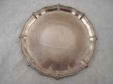 Appraisal: A silver waiter with shaped and beaded rim by Mappin