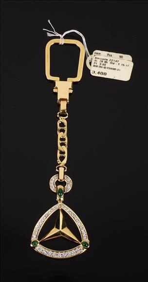 Appraisal: An carat yellow gold emerald and diamond key ring by