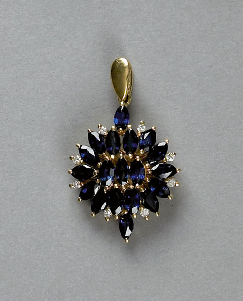 Appraisal: K yellow gold pendant with a cluster of marquise cut