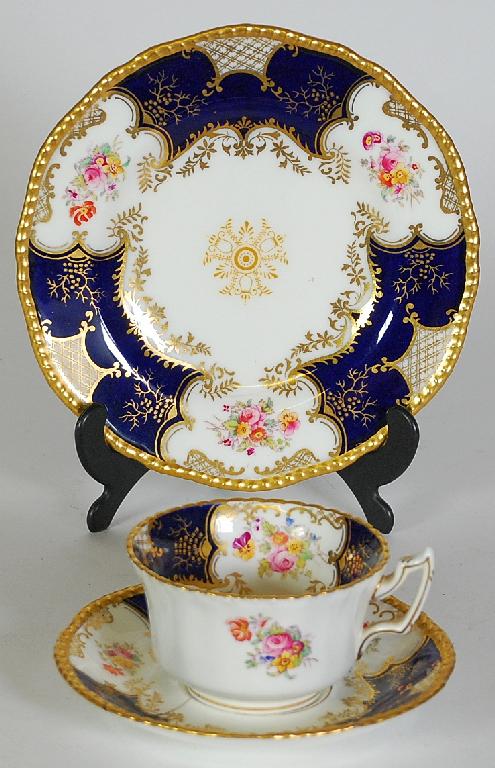 Appraisal: EARLY th CENTURY COALPORT CHINA TRIO decorated with floral cartouches