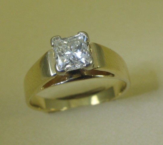 Appraisal: DIAMOND AND FOURTEEN KARAT GOLD SOLITAIRE RING with four prongs