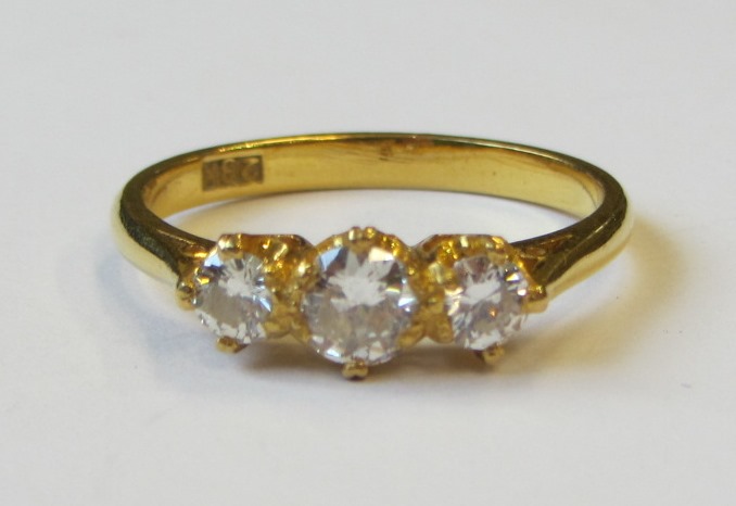 Appraisal: A gold and diamond set three stone ring claw set