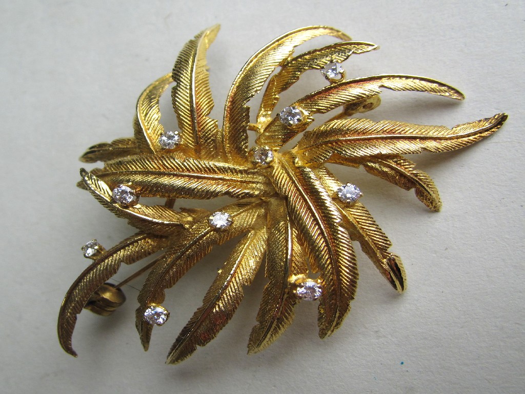 Appraisal: Yellow metal leaf brooch with brilliant cut diamond insets