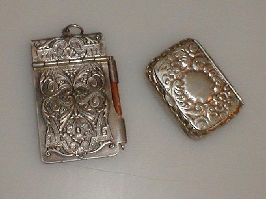 Appraisal: A chatelaine style white metal cased note pad and pencil