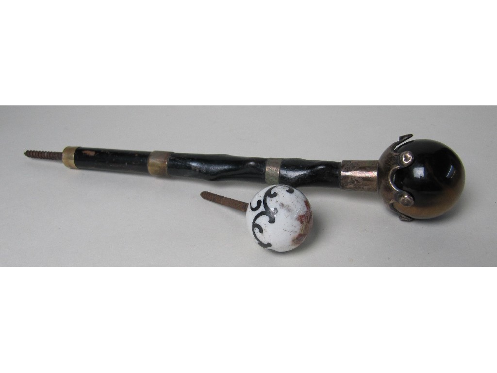 Appraisal: A Victorian silver mounted umbrella handle with tigers eye handle