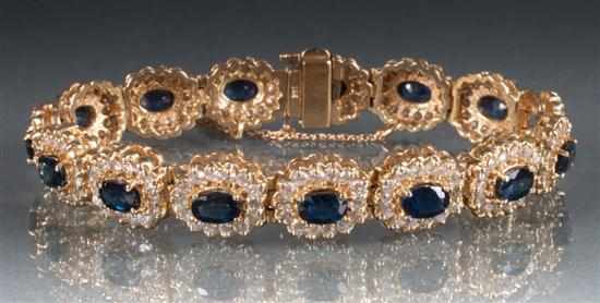 Appraisal: K gold diamond and sapphire oval link bracelet diamonds approximately