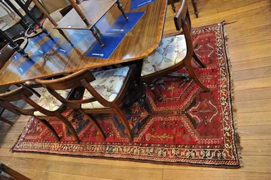 Appraisal: A PERSIAN RUG IN RED AND CREAM TONES