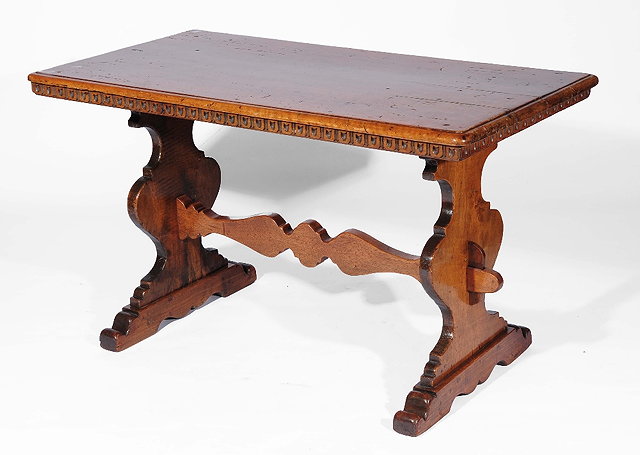 Appraisal: A Spanish style walnut centre tableon stretcher supports having a