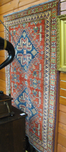 Appraisal: PAKISTANI KAZAK AREA RUG double blue geometric medallion and surround