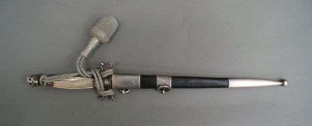 Appraisal: A Dress dagger with pearl shell scales cross guard flamboyant