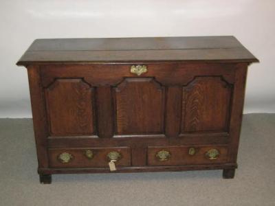 Appraisal: A GEORGE III OAK PANELLED MULE CHEST th century with