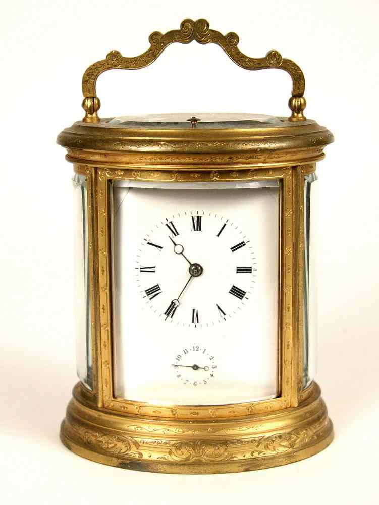 Appraisal: OVAL CARRIAGE CLOCK - th c Gilt Brass Oval Crystal