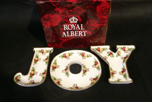 Appraisal: A boxed Royal Albert set of letter form dishes spelling