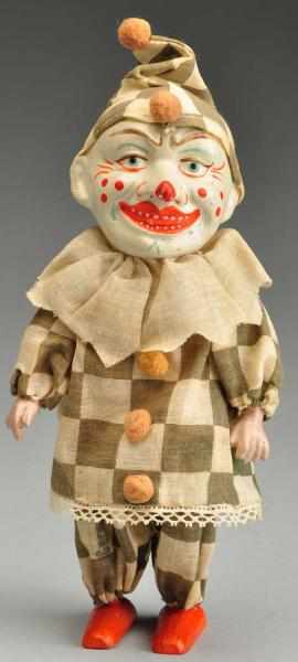 Appraisal: Mechanical Wind-Up Clown Toy Description Well-modeled papier-m ch head with