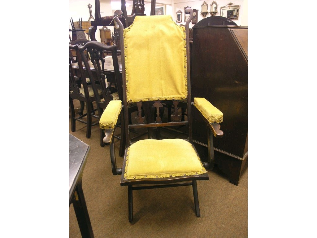 Appraisal: An early th century 'steamer' armchair with upholstered seat back