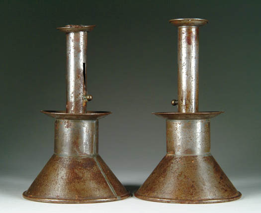 Appraisal: PAIR OF TIN ADJUSTABLE WEIGHTED CANDLESTICKS Cone shaped weighted base