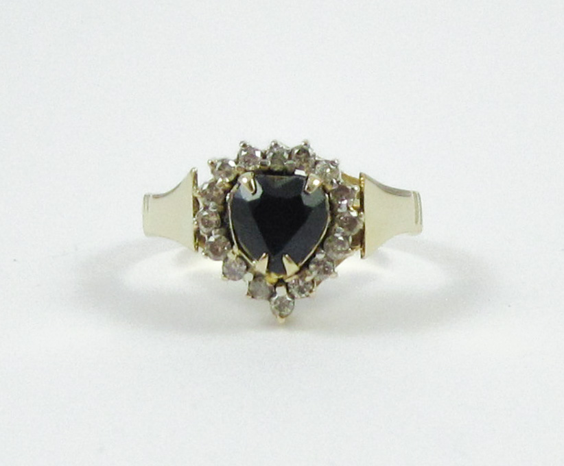 Appraisal: SAPPHIRE DIAMOND AND FOURTEEN KARAT GOLD RING with round-cut diamonds