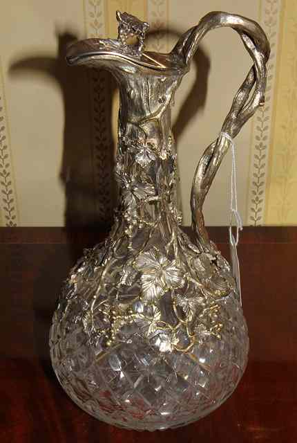 Appraisal: A HOBNAIL CUT CLARET JUG with silver plated mounts in