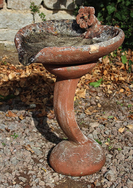 Appraisal: A BROWN PAINTED COMPOSITE STONE FOUNTAIN in the form of