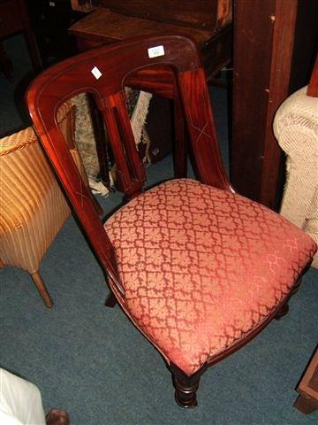 Appraisal: A pair of th Century mahogany dining chairs with curving