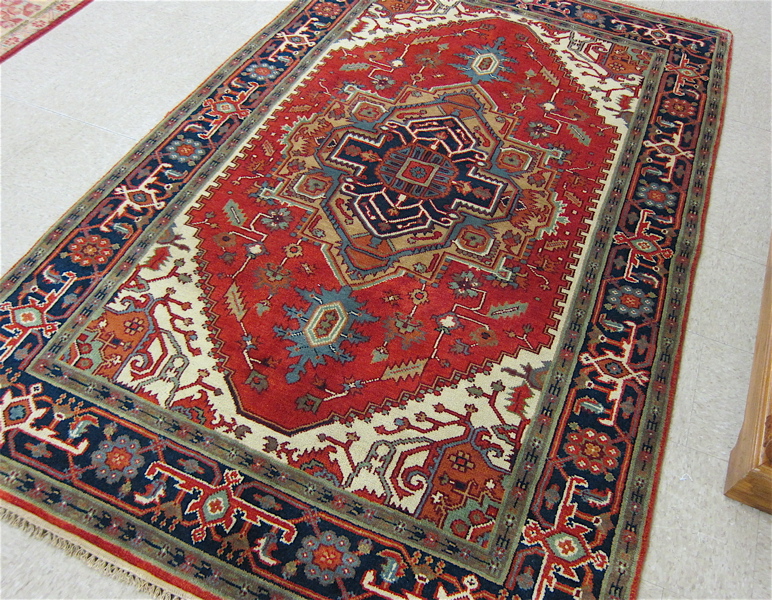 Appraisal: HAND KNOTTED ORIENTAL AREA RUG Persian Serapi design stylized floral