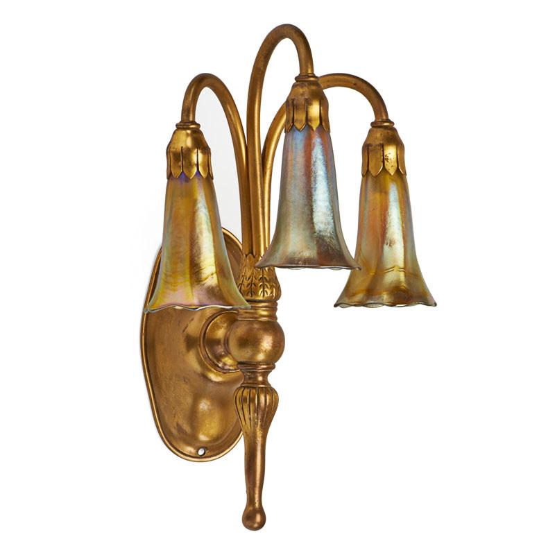 Appraisal: TIFFANY STUDIOS Three-light sconce TIFFANY STUDIOS Three-light sconce with gold