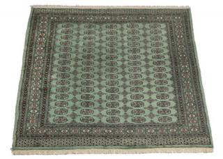 Appraisal: Hand knotted Pakistani Bokhara wool rug having five rows of