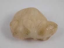 Appraisal: A Chinese white jade carving of a fruit cm long