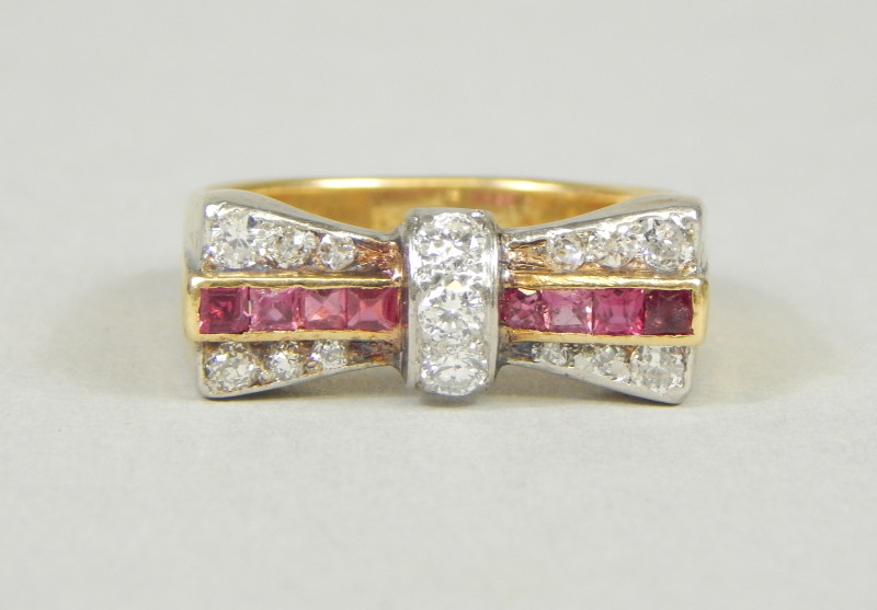 Appraisal: A ruby and diamond cocktail ring shaped in a bow