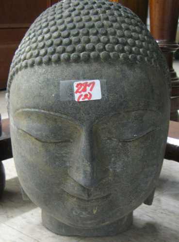 Appraisal: TWO GRANITE SCULPTED BUSTS OF GAUTAMA BUDDHA both with elongated