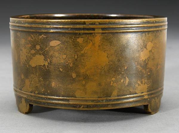 Appraisal: A bronze incense burner Late Qing Dynasty Of cylindrical form