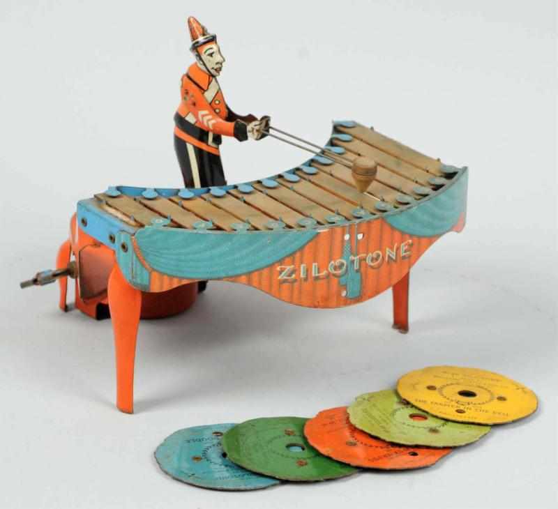 Appraisal: Tin Litho Wolverine Xylophone Player Wind-Up Toy American Works well