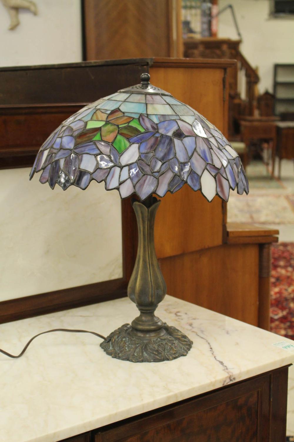 Appraisal: A STAINED AND LEADED GLASS TABLE LAMP with conical form