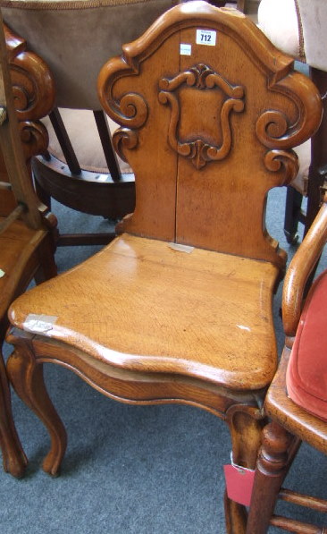 Appraisal: A pair of mid Victorian carved oak hall chairs each