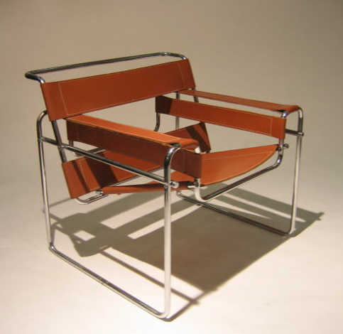 Appraisal: MARCEL BREUER Wassily armchair chromed tubular frame with brown leather