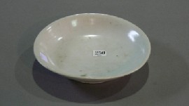 Appraisal: A Chinese white ground shallow bowl incised with a dragon