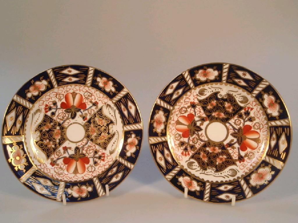 Appraisal: A pair of Royal Crown Derby tea plates in the