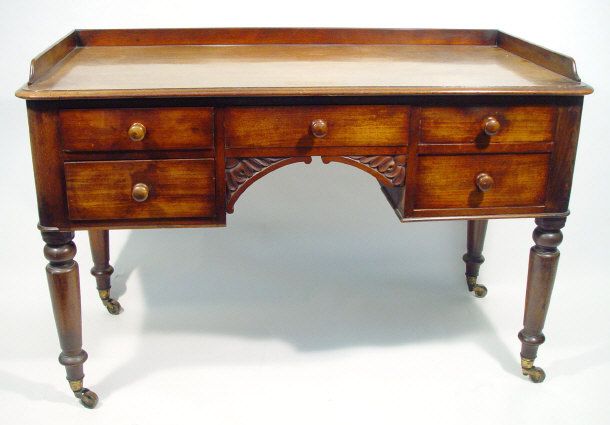 Appraisal: Victorian mahogany writing table the galleried top above a series