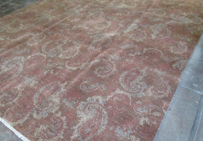 Appraisal: HAND KNOTTED ORIENTAL CARPET featuring a non-traditional overall floral design