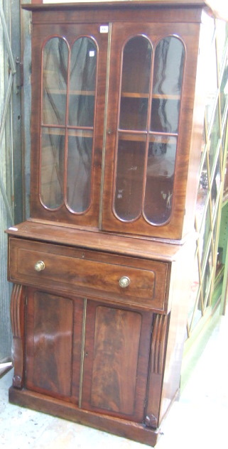 Appraisal: A small Victorian mahogany secretaire bookcase the plain cornice over