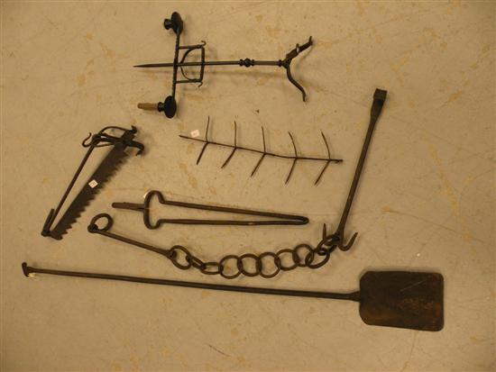 Appraisal: Wrought iron peel tramel tongs double candleholder on tripod base