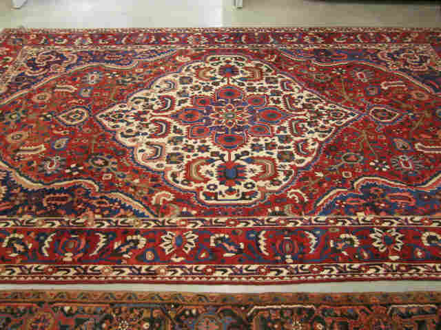 Appraisal: Bakhteiari Persian Handmade Room Size Rug reds blues ivory stylized