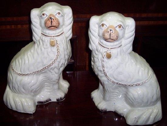 Appraisal: A pair of th Century Staffordshire dogs cm high