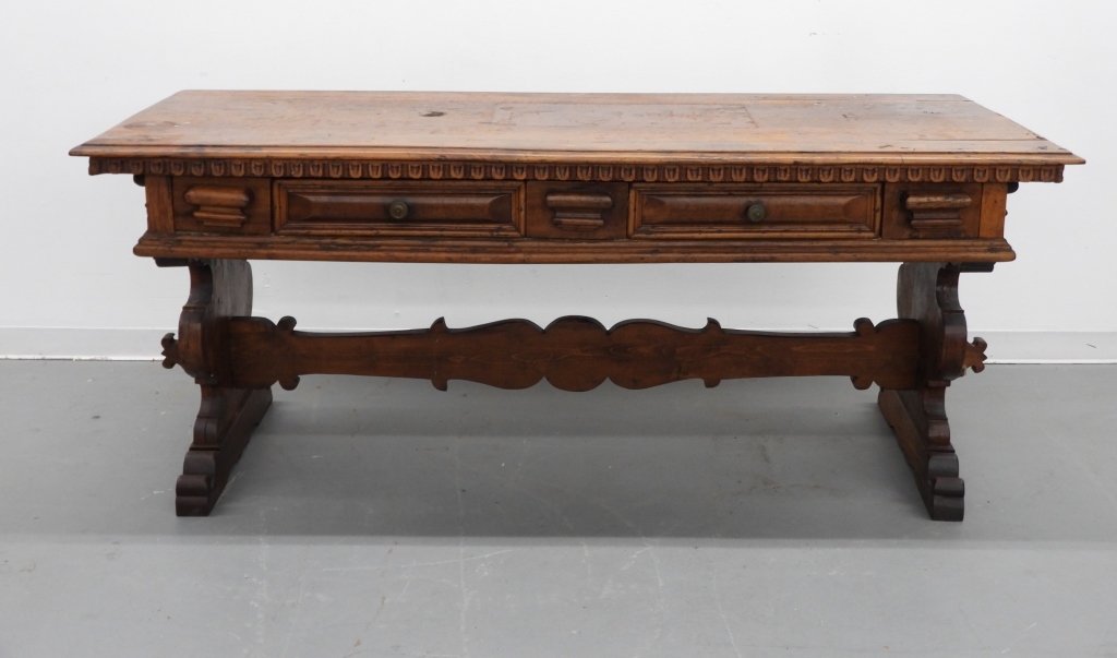 Appraisal: CONTINENTAL CARVED WOOD LIBRARY TRESTLE TABLE Europe th CenturyRectangular top