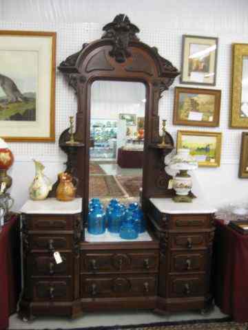 Appraisal: Marble Top Dresser Mirror ornatecarving four drawers on each side