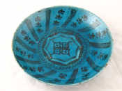 Appraisal: A Turkish earthenware bowl with black freehand decoration and turquoise