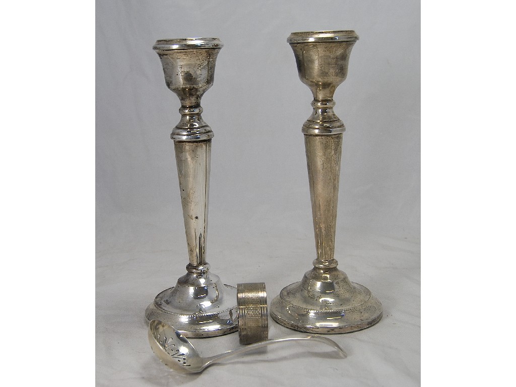 Appraisal: Pair of filled silver candlesticks with bead edge approx cm