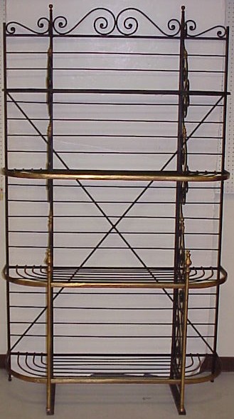 Appraisal: Brass and iron bakers' rack Scrolled iron top rail with